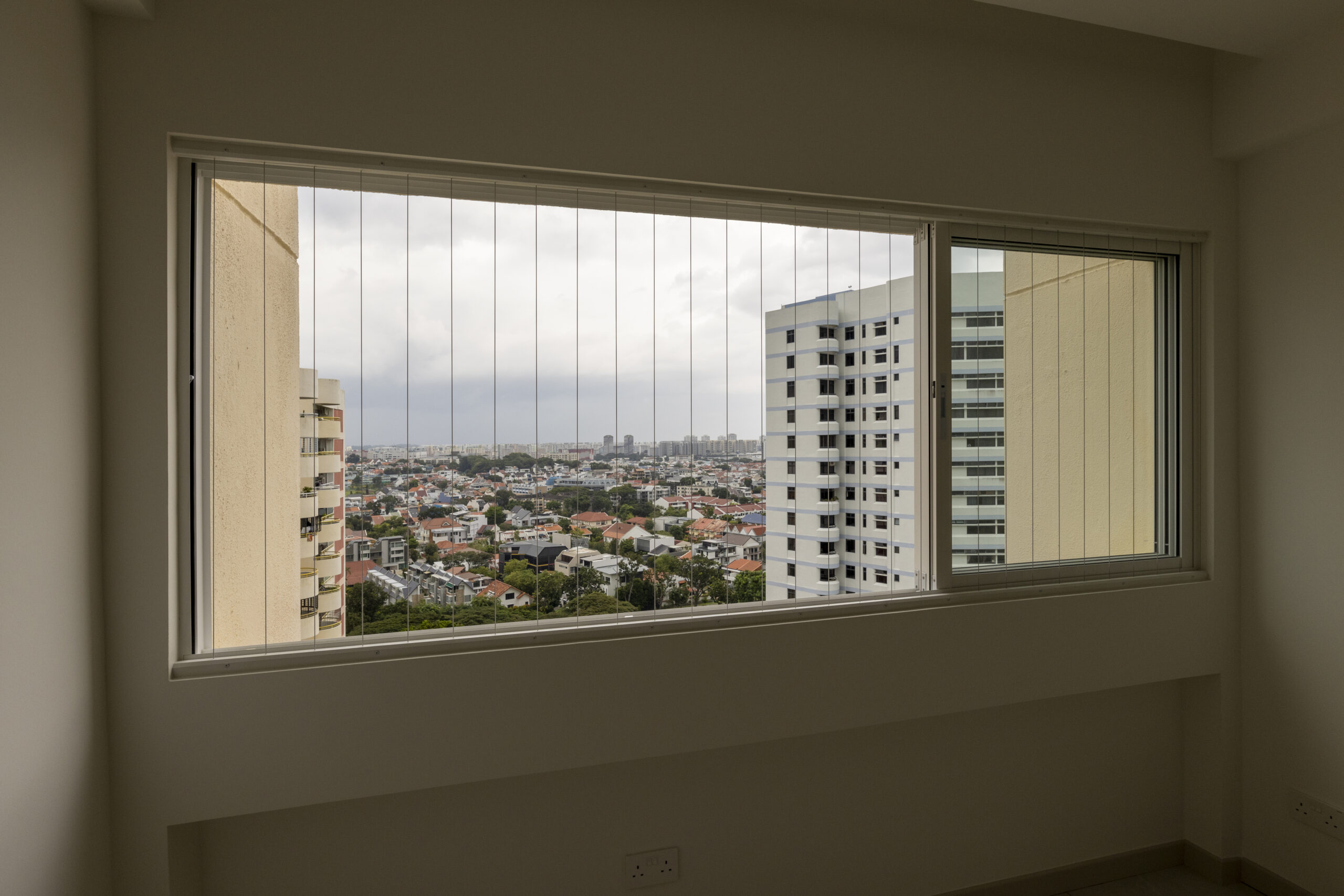 Aluminum window and door installation at Marine Vista with 4-track sliding door and white powder-coated finish
