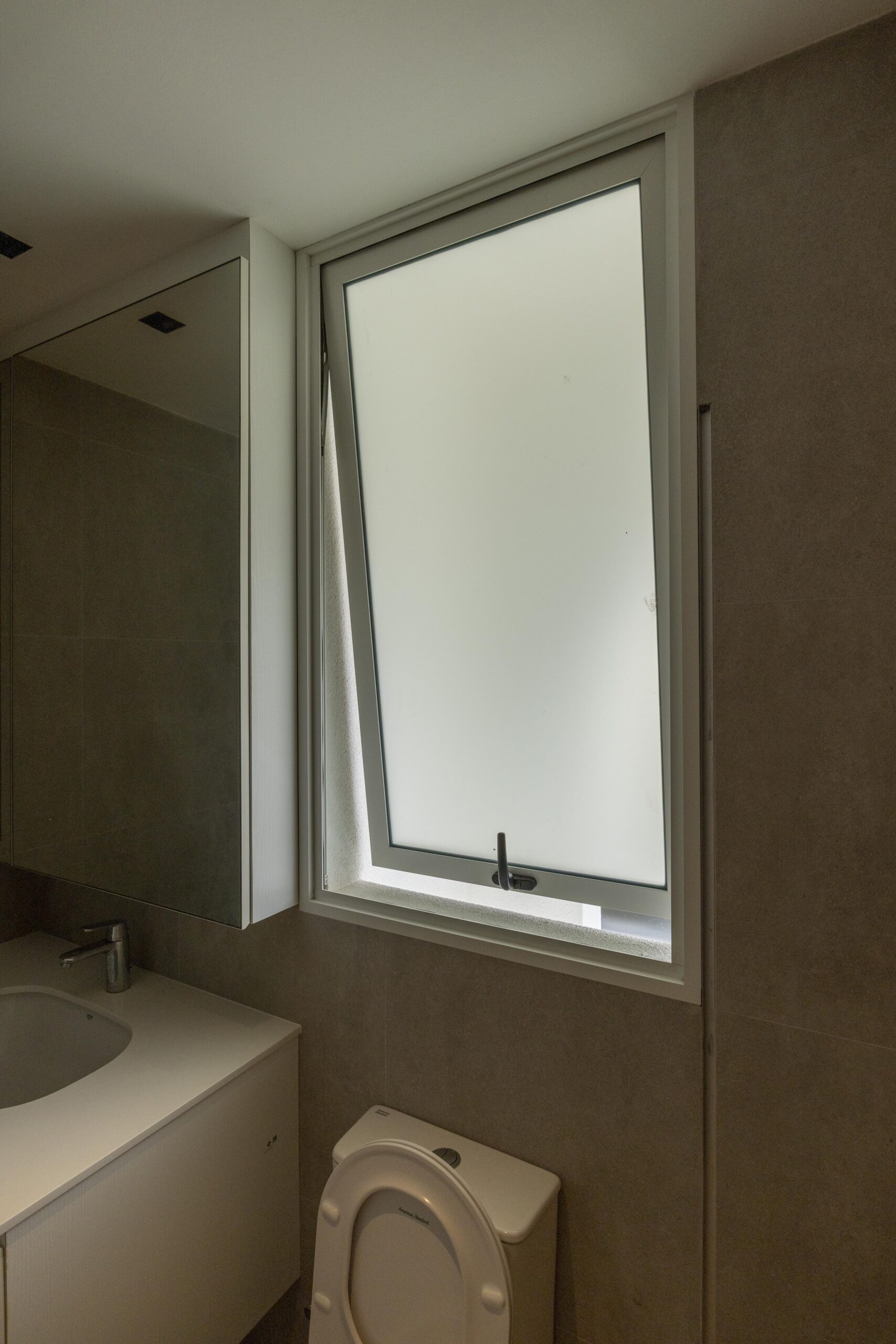 Bedok Ria window installation with white aluminium frames and black handles