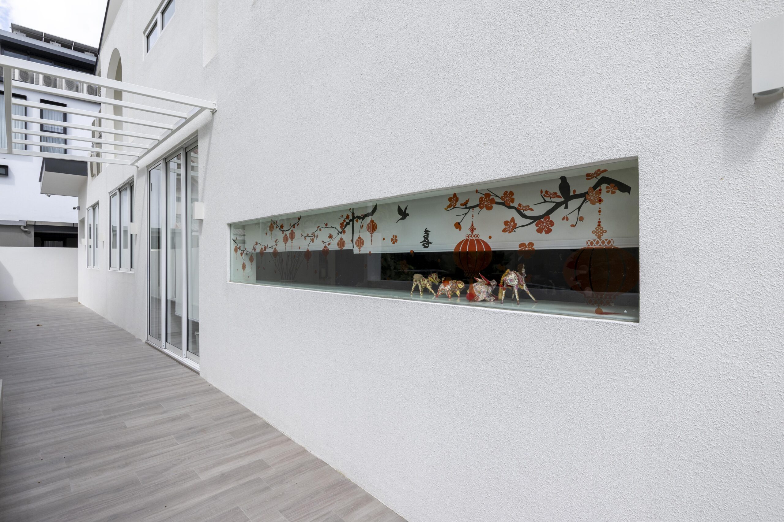 Full window and door system installation at Bedok Ria with sleek white frames and black accents