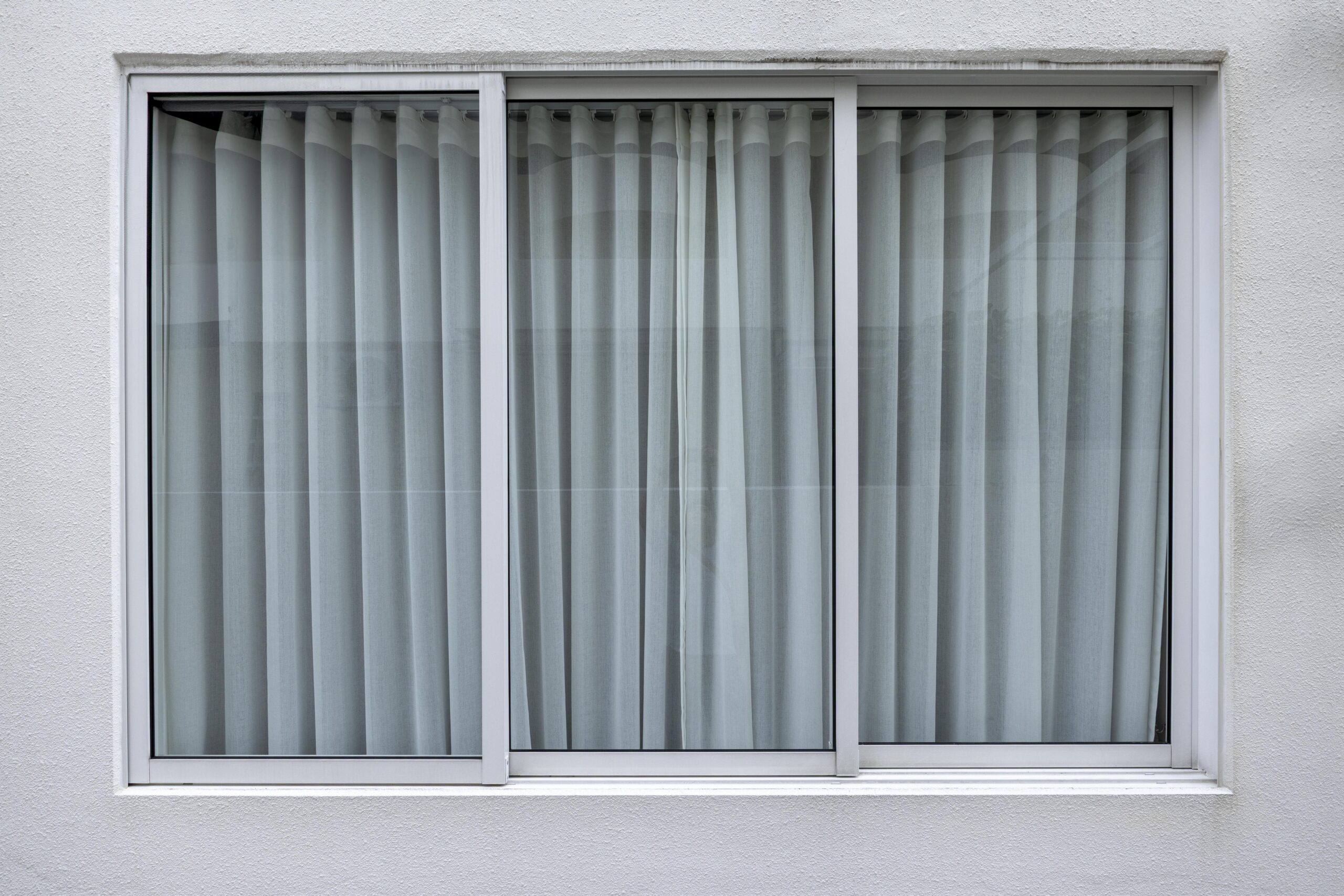 Bedok Ria window installation with white aluminium frames