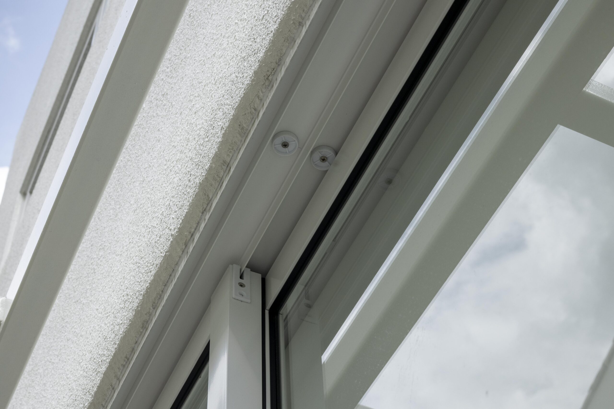 Full window and door system installation at Bedok Ria with sleek white frames