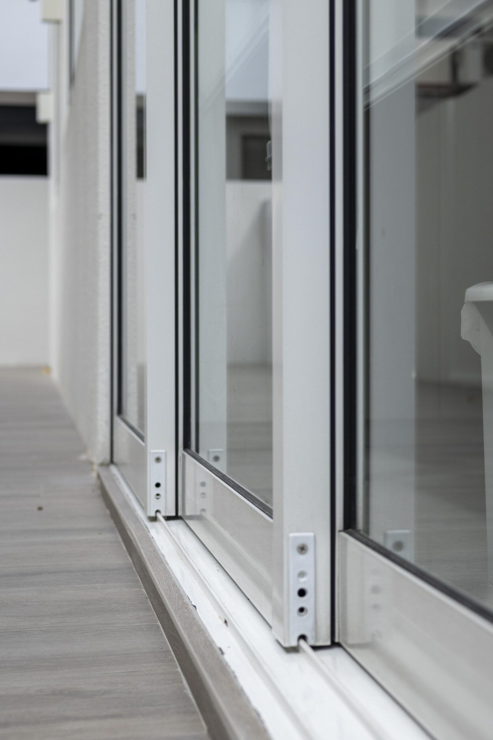 Full window and door system installation at Bedok Ria with sleek white frames