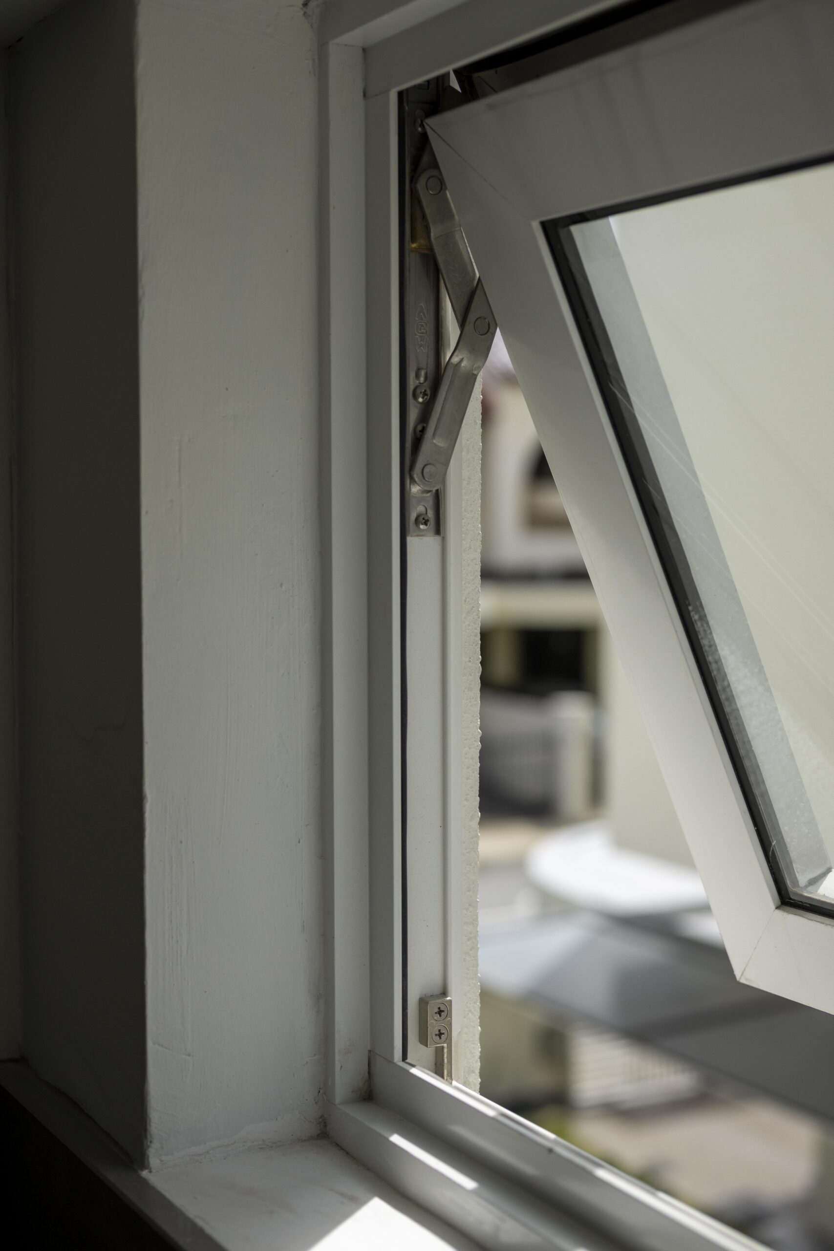 Bedok Ria window installation with white aluminium frames and black handles