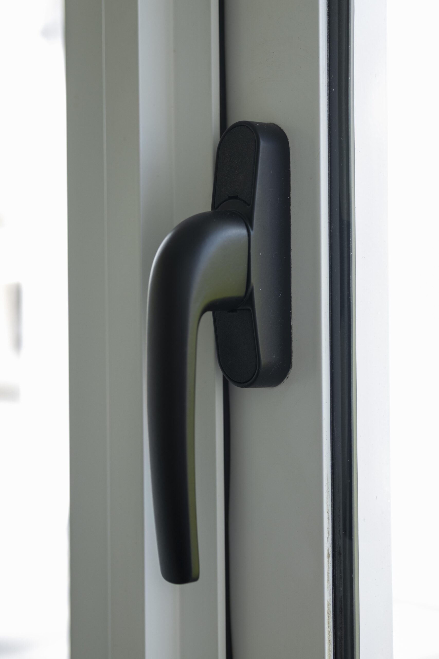 Bedok Ria window installation with white aluminium frames and black handles