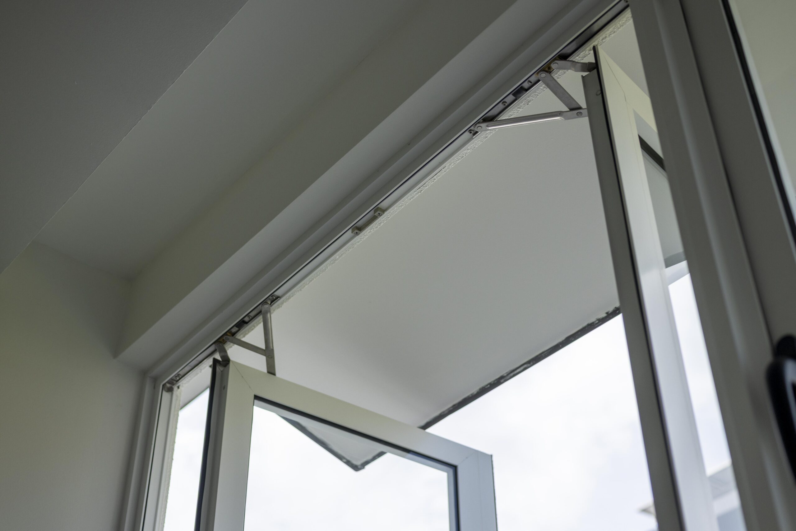 Bedok Ria window installation with white aluminium frames and black handles
