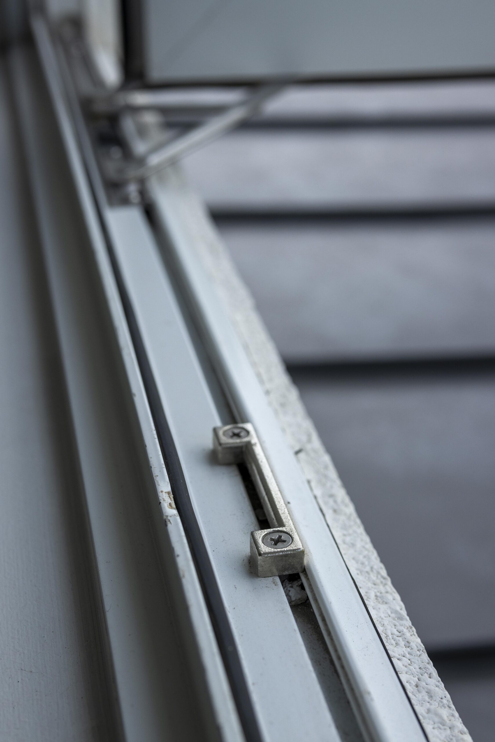 Bedok Ria window installation with white aluminium frames and black handles