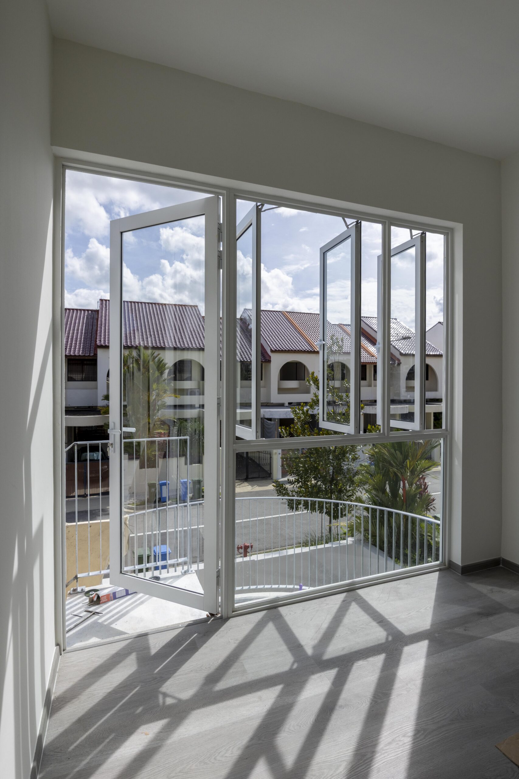 Full window and door system installation at Bedok Ria with sleek white frames