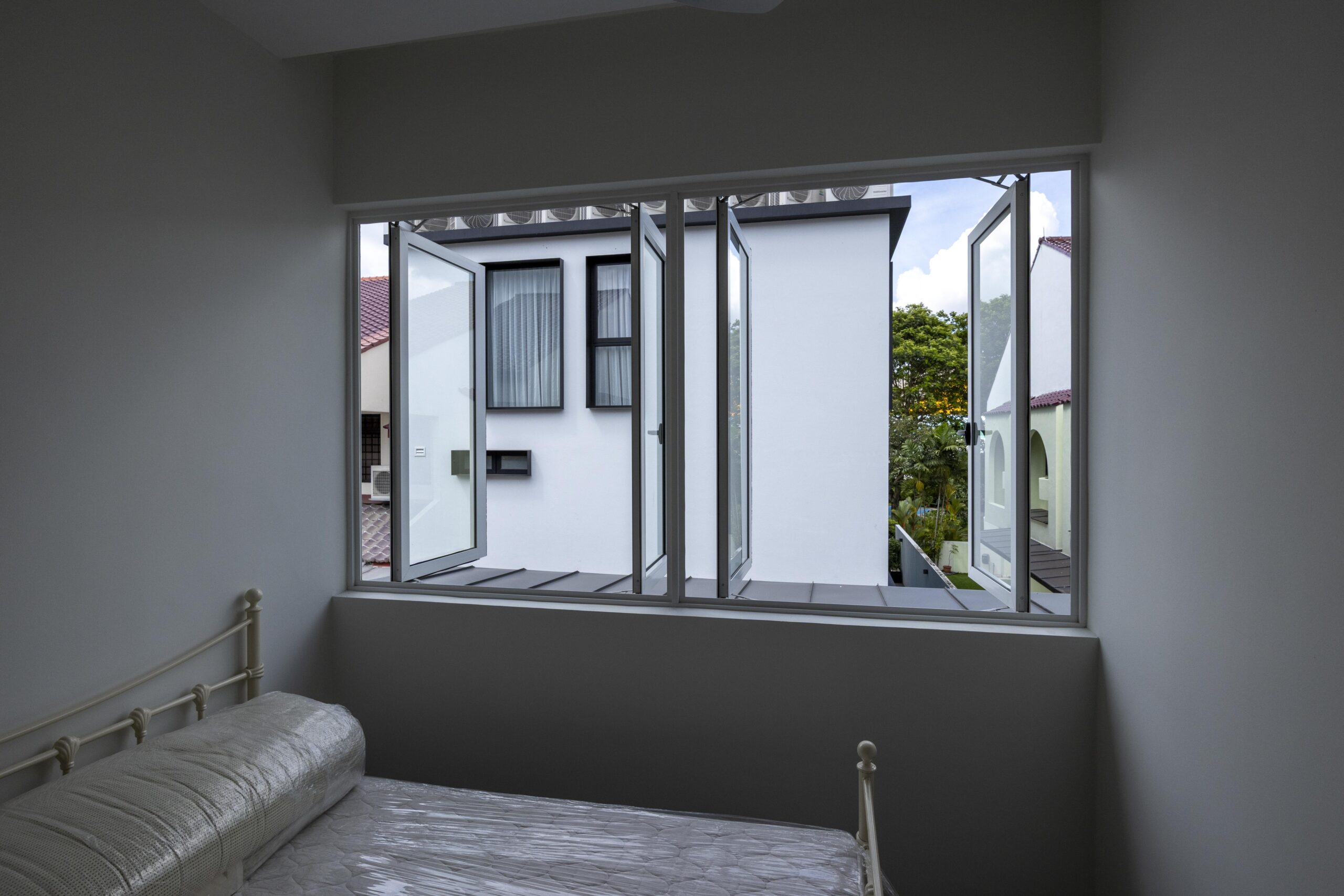 Bedok Ria window installation with white aluminium frames and black handles