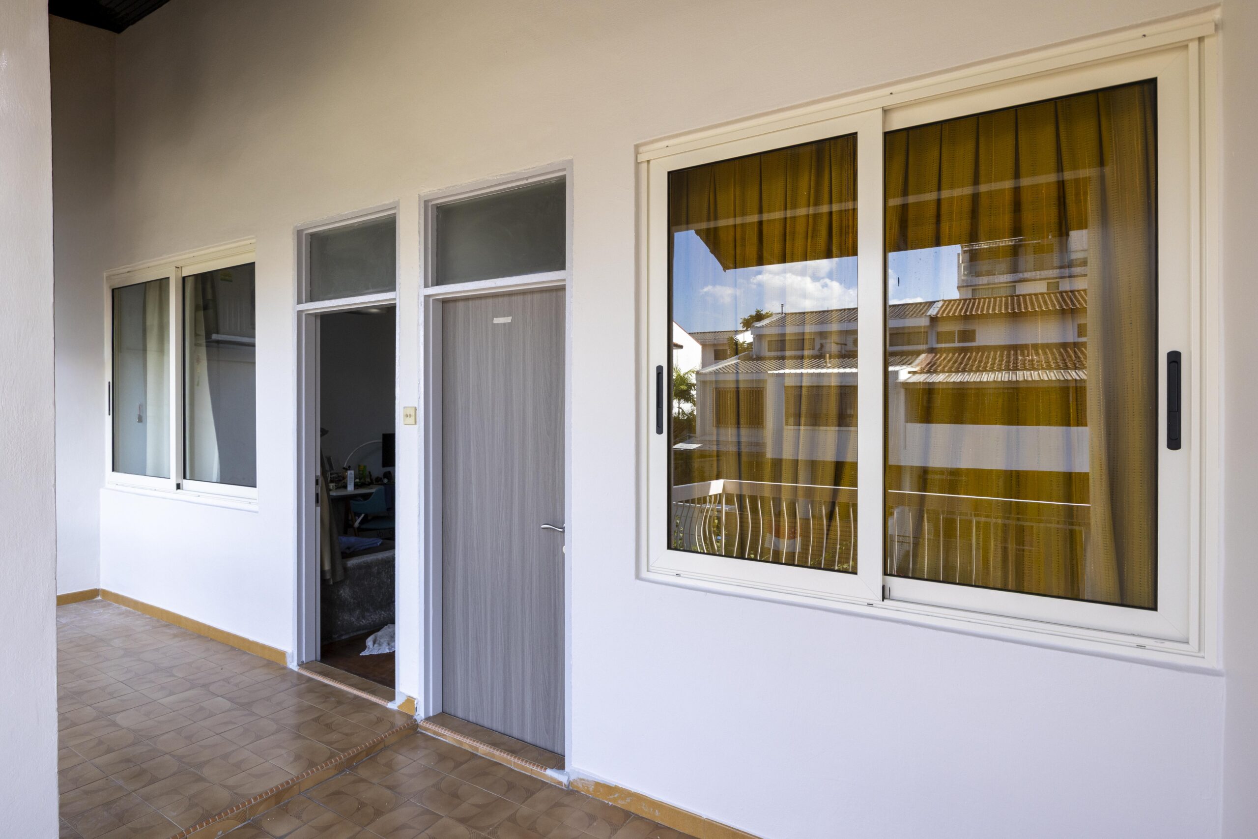 Completed window and door installation at Toh Tuck Place using premium aluminium systems.