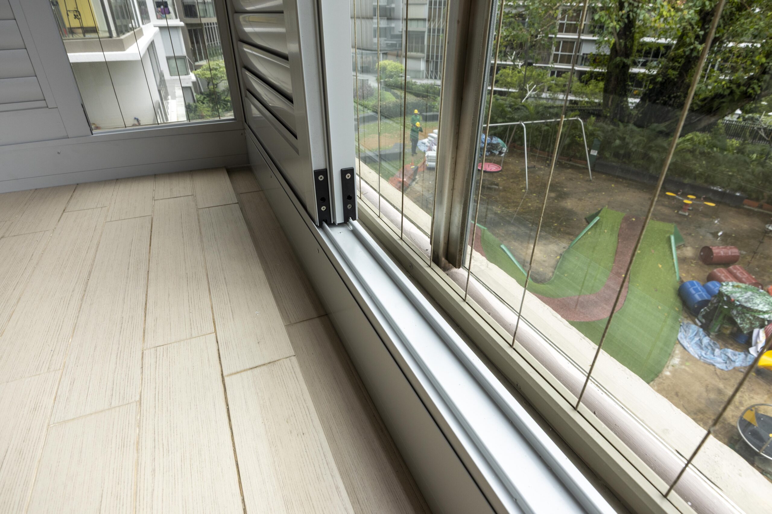 Sliding doors with powder coated adjustable aerofoil louvres installed along the balcony at Bartley Residence