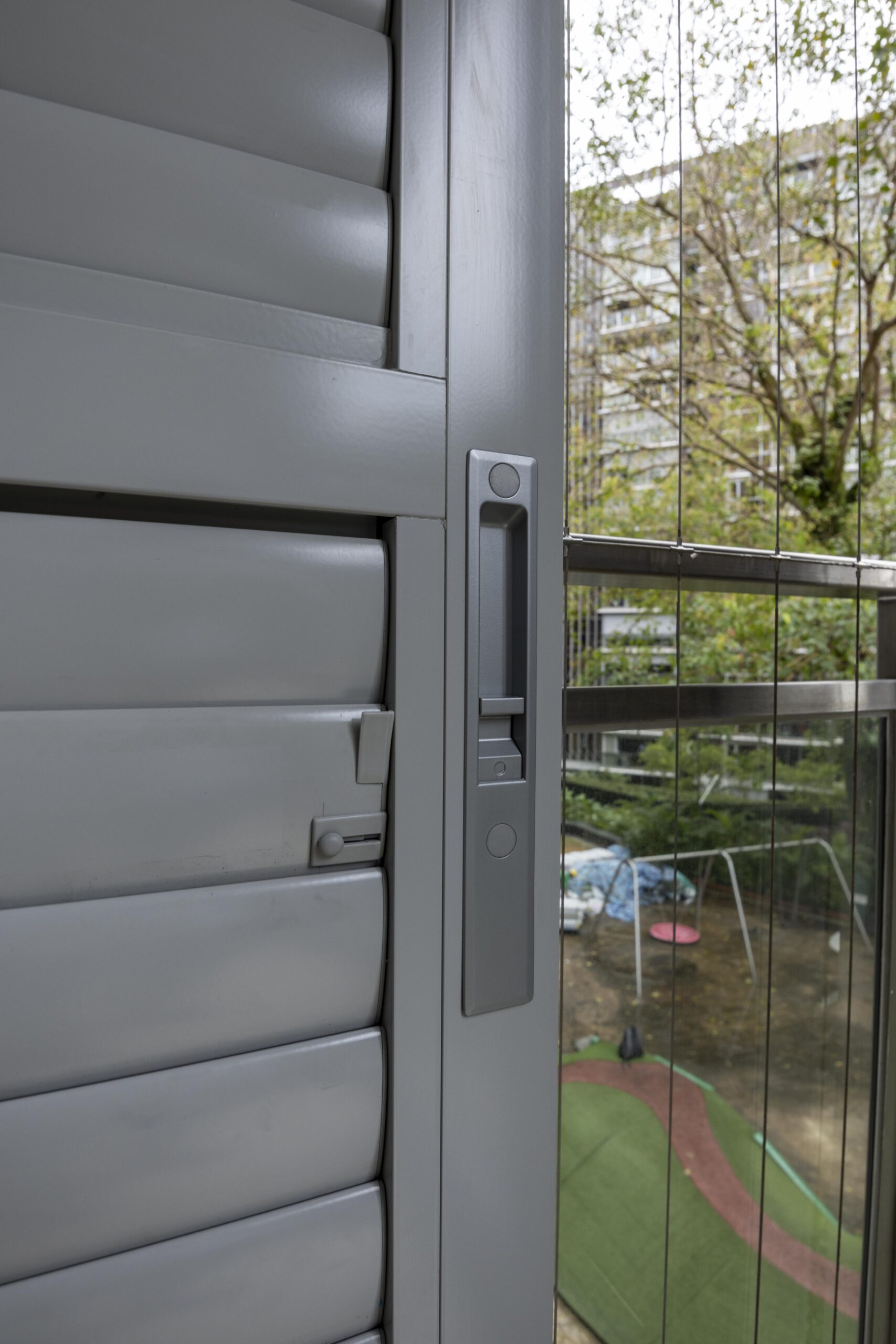 Close-up of powder coated adjustable aerofoil louvres with concealed adjustment mechanism