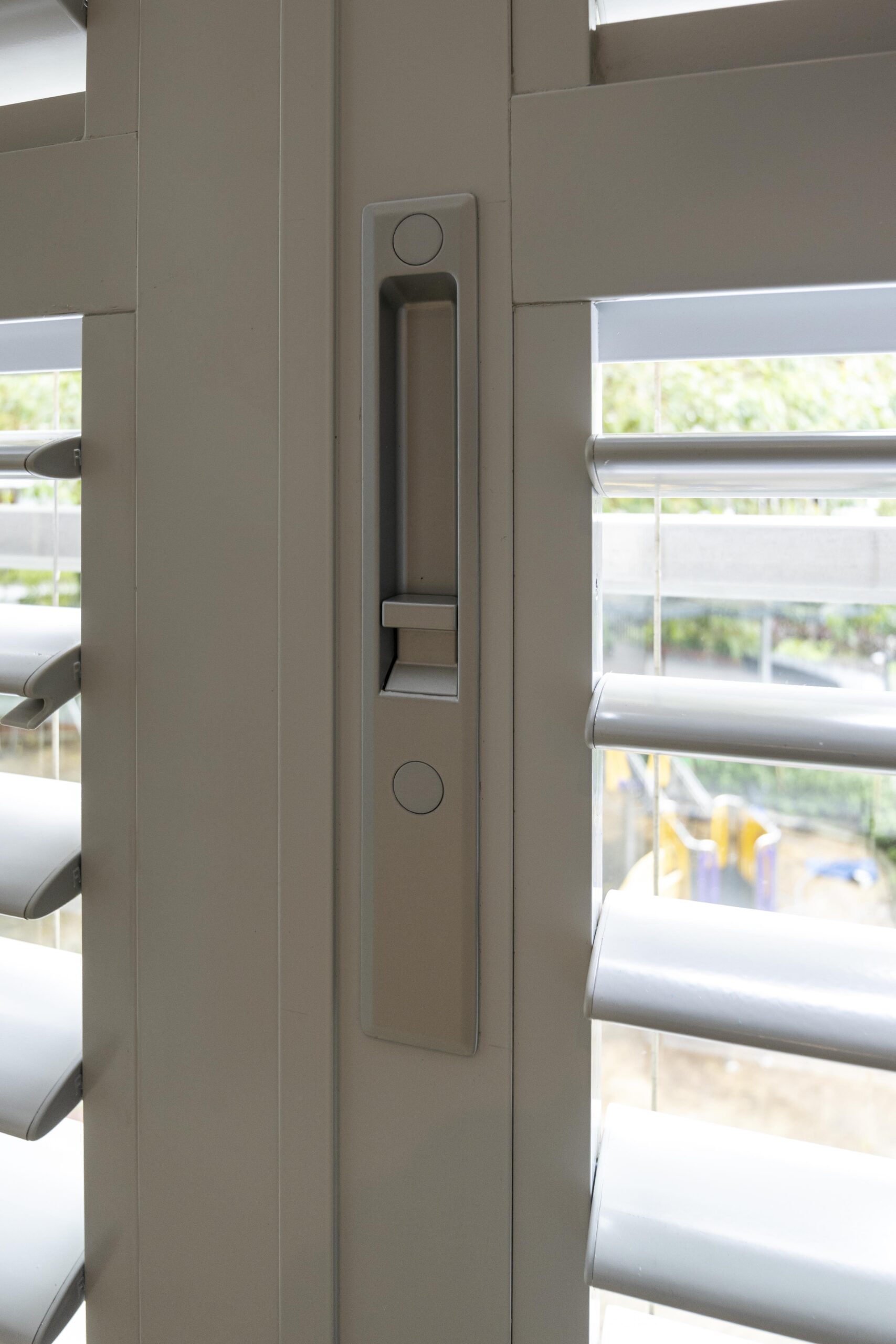 Close-up of powder coated adjustable aerofoil louvres with concealed adjustment mechanism