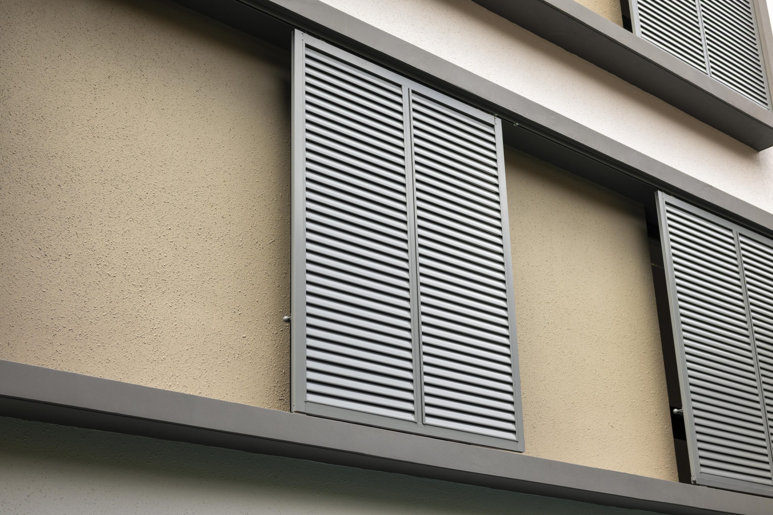 Sliding aluminium screen panels complementing existing casement windows